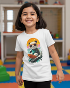Child wearing a white t-shirt with a panda graphic in a colorful room.