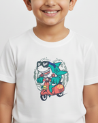 Child wearing a white t-shirt with a shark graphic design on a plain background