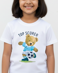 Child wearing a white t-shirt with a teddy bear graphic and 'Top Scorer' text on a plain background