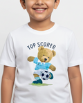 Child wearing a white t-shirt with a teddy bear holding a soccer ball and 'Top Scorer' text.