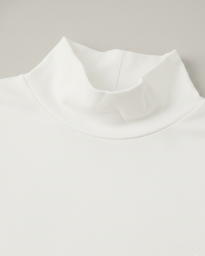 Close-up of a white mock neck tshirt on a light gray background