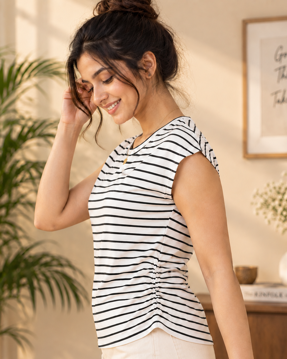 Designed for effortless everyday style, this black and white striped T-shirt combines comfort with a feminine side-gather detail. 