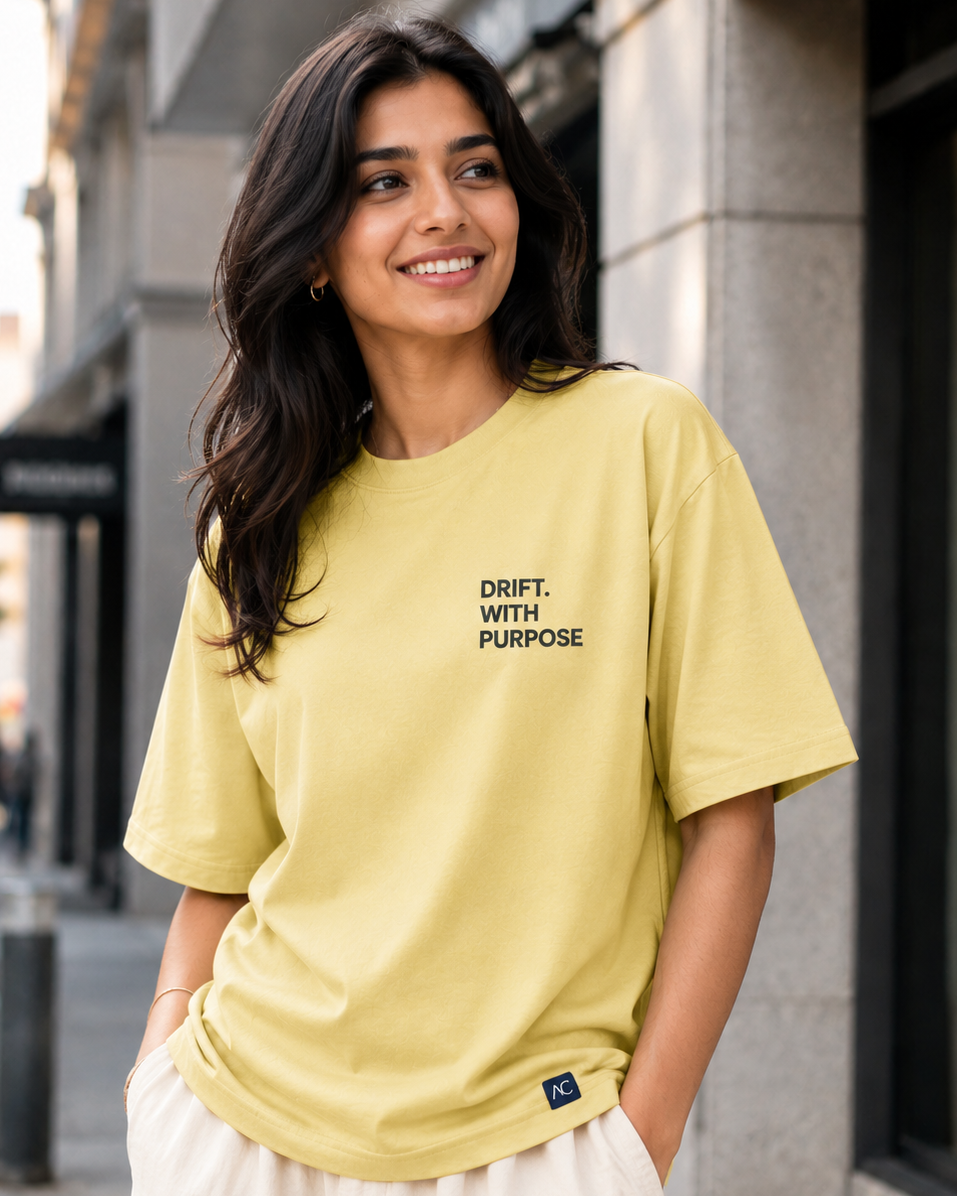 Young Women wearing a Drift With Purpose navy print in yellow Oversized T-shirt 