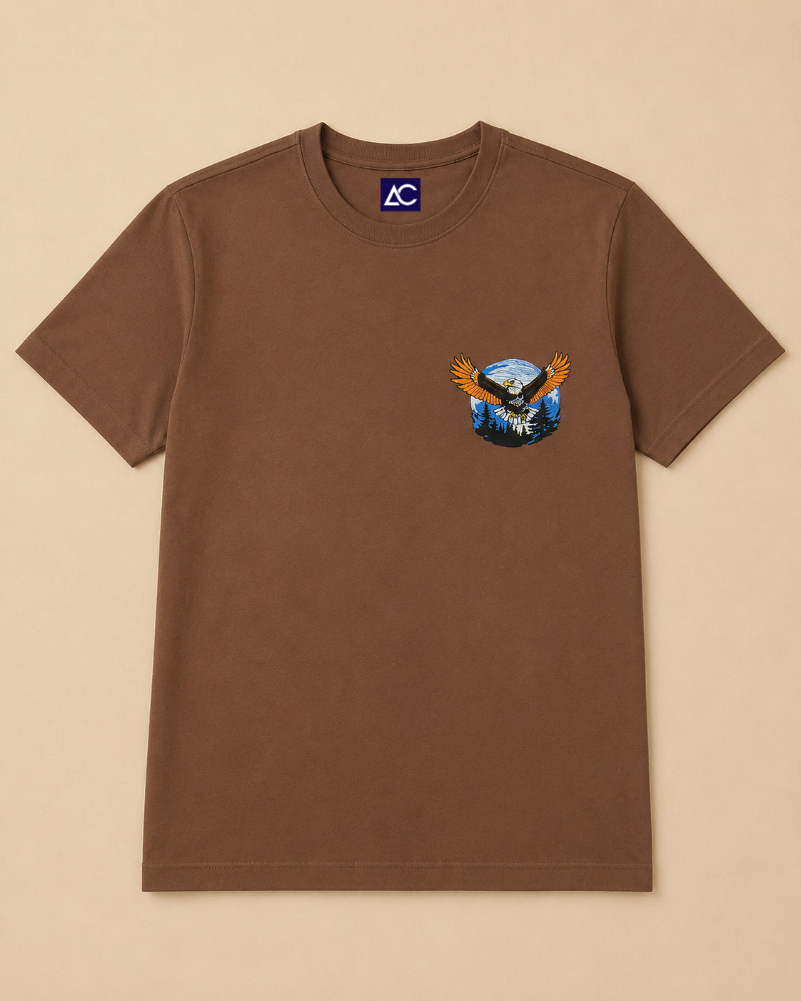 Eagle embroidered Brown Regular Fit T-shirt placed on the Light Beige Background
