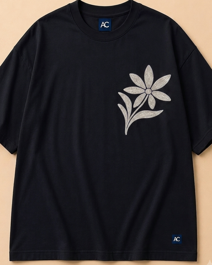 Floral Black Oversized T shirt placed on light beige background