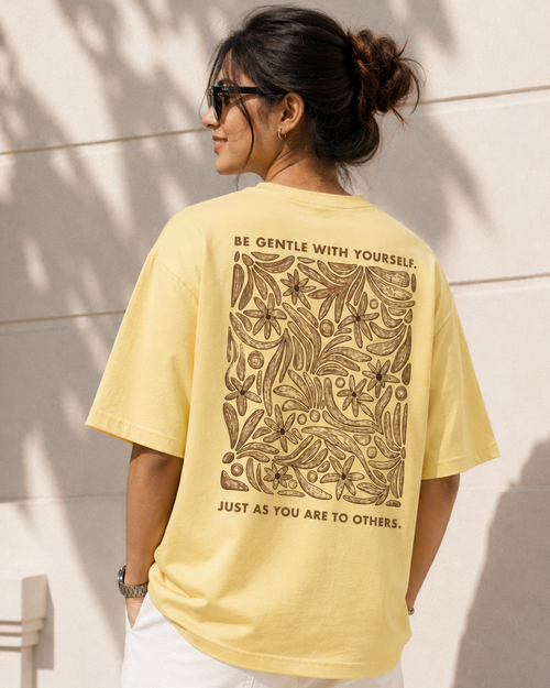 Women wearing a Floral Print in yellow oversized T-shirt back view