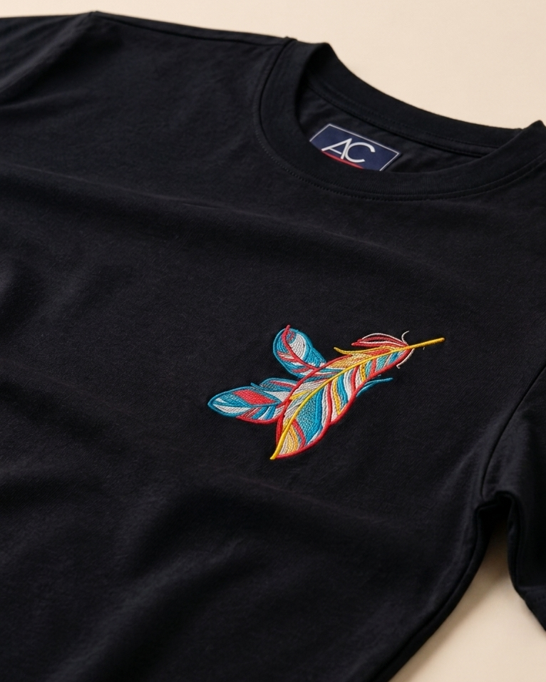 Focus view of Feather embroidered Black Regular Fit T-shirt placed on the Light Beige background