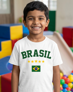 Child wearing a 'BRASIL' t-shirt with a Brazilian flag in a colorful indoor playground.