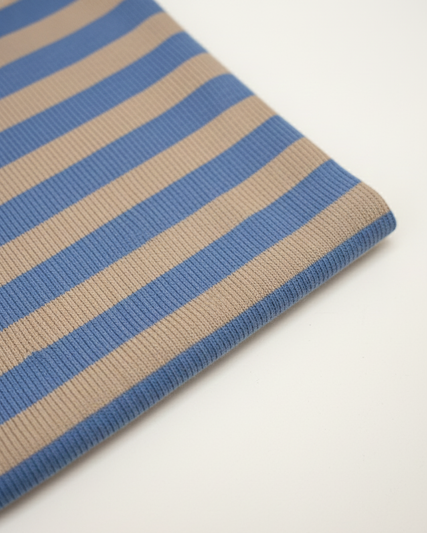 Close-up of a blue and beige striped fabric on a white background