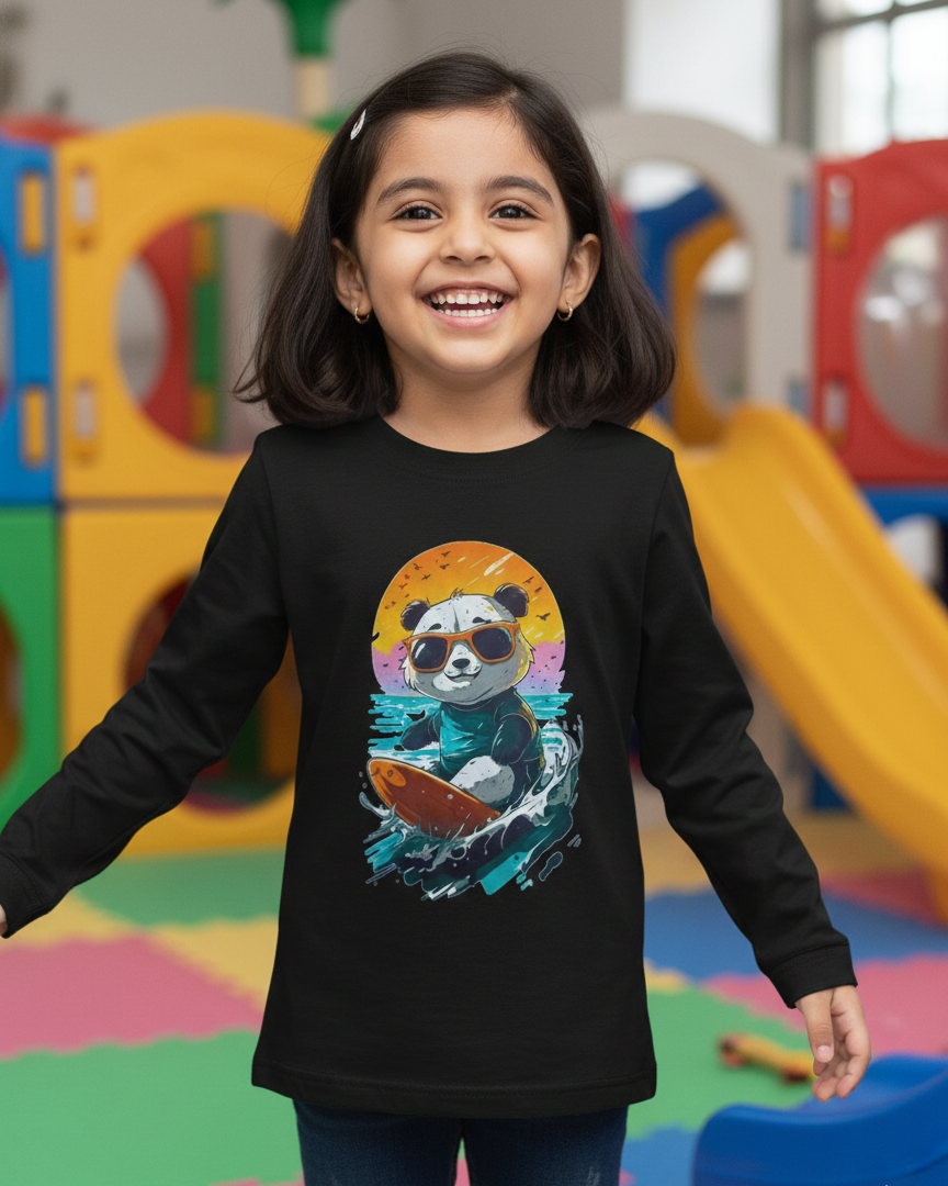Child wearing a black long-sleeve shirt with a colorful panda design in a playground.