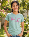 Girl wearing a Green T-shirt with Live Simply print 