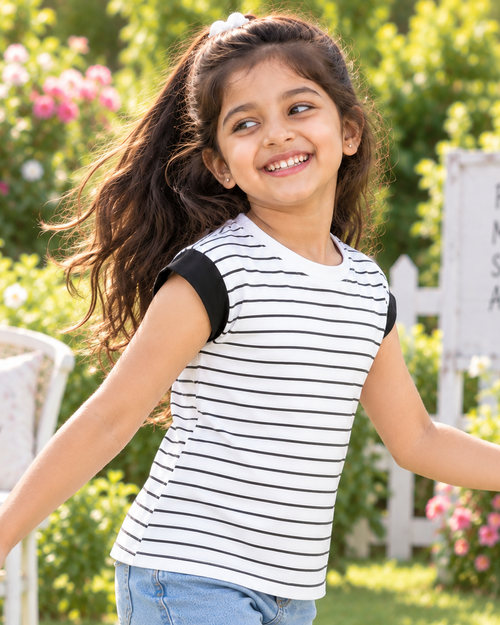 A classic black and white striped T-shirt featuring comfortable cap sleeves and a stylish look, perfect for active days and outdoor adventures.