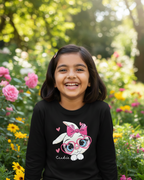 Girl wearing black rabbit T-shirt in garden background.