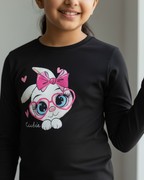 Girl wearing black rabbit T-shirt in grey and white background.