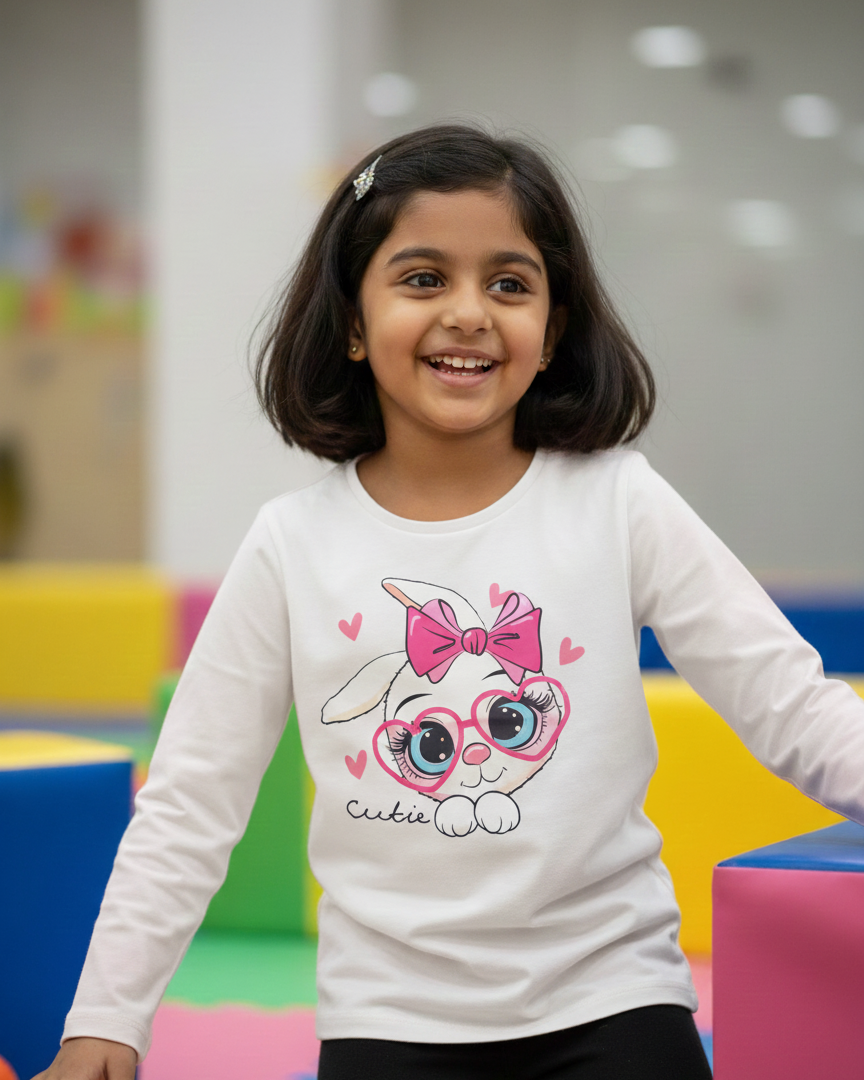 Girl wearing white rabbit T-shirt in indoor playground background