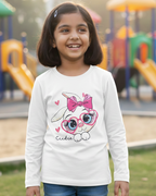Girl wearing white rabbit T-shirt in outdoor playground background