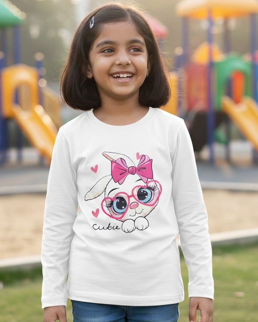Girl wearing white rabbit T-shirt in outdoor playground background