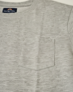 Gray t-shirt with a pocket and a visible brand logo on a light gray background