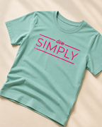 Green T-shirt with Live Simply print close view of the print  placed on light beige background