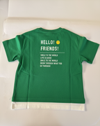 Green t-shirt with text on the back on a white surface