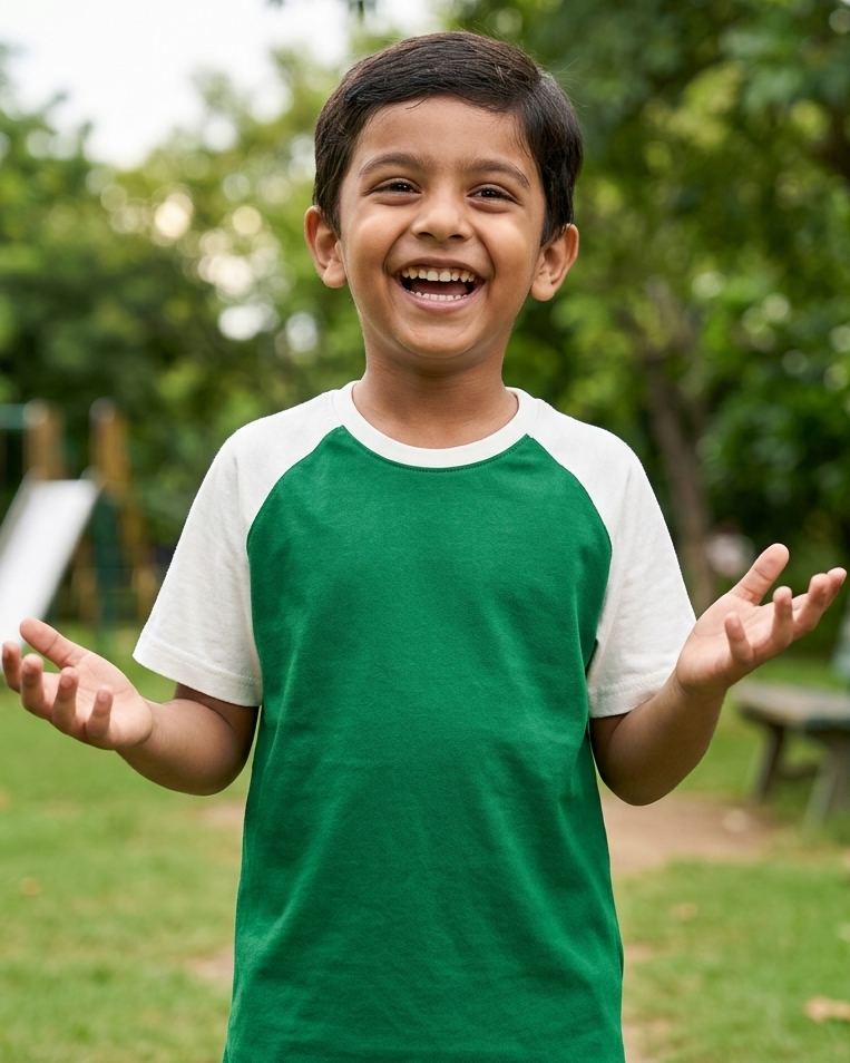 A boy wearing a Green with White Raglan Sleeve cotton T-Shirt  he feels happy and comfort with the T-shirt.