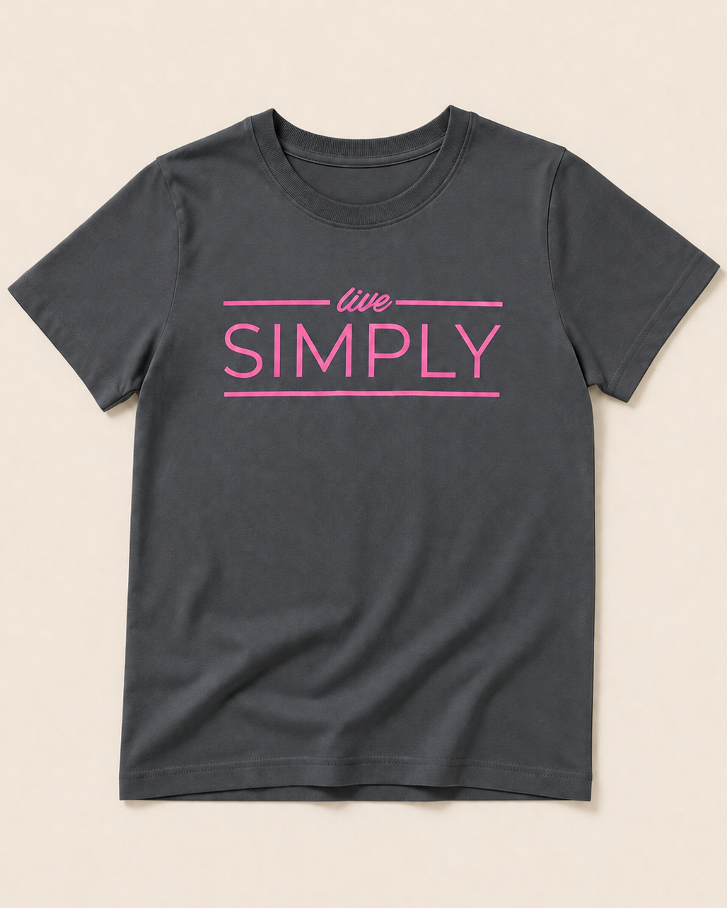 Grey T-shirt with Live Simply print placed on light beige background