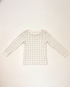 Grid-patterned long-sleeve shirt on a light beige background
