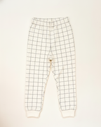 Grid-patterned pants on a white background