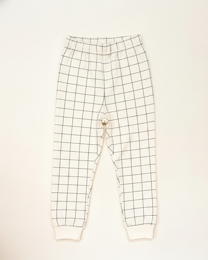 Grid-patterned pants on a white background