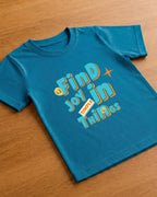 Joy print in Kids Teal Blue T-shirt placed on wooden floor