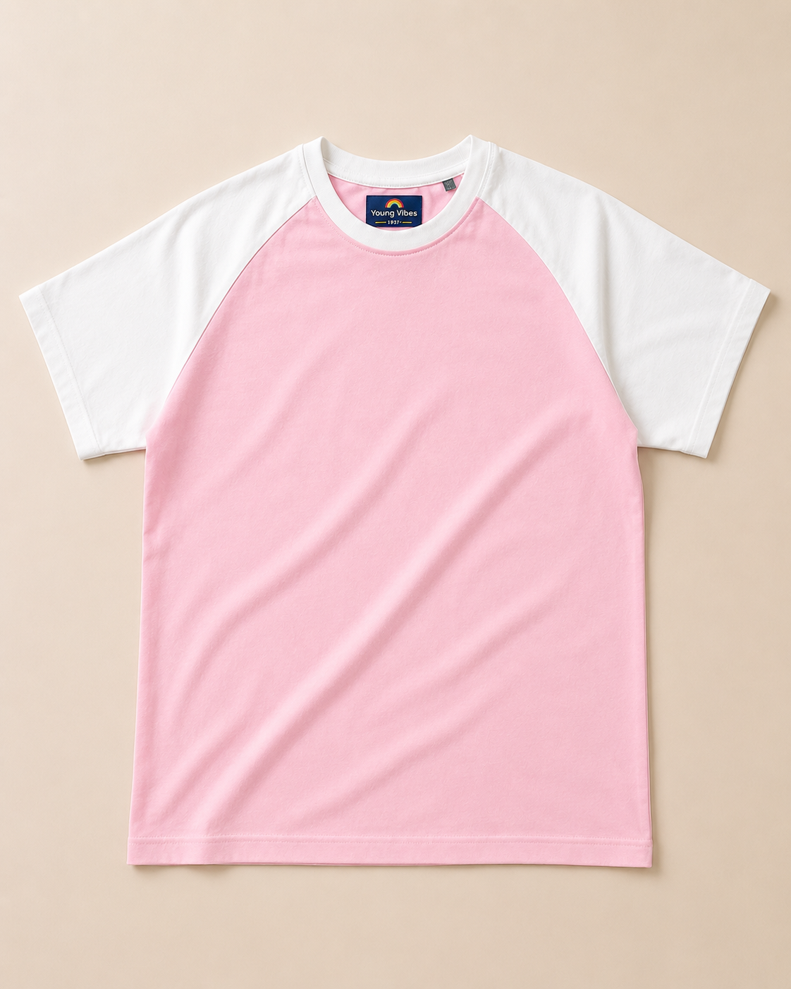 Kids Baby Pink with White Raglan Sleeve Cotton T-shirt Placed on lite beige background