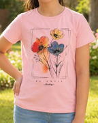 Girl wearing a Baby pink T-shirt with floral print close view 