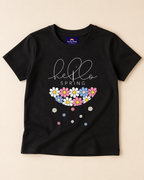 Hello spring print in Black T-shirt placed on the light beige background