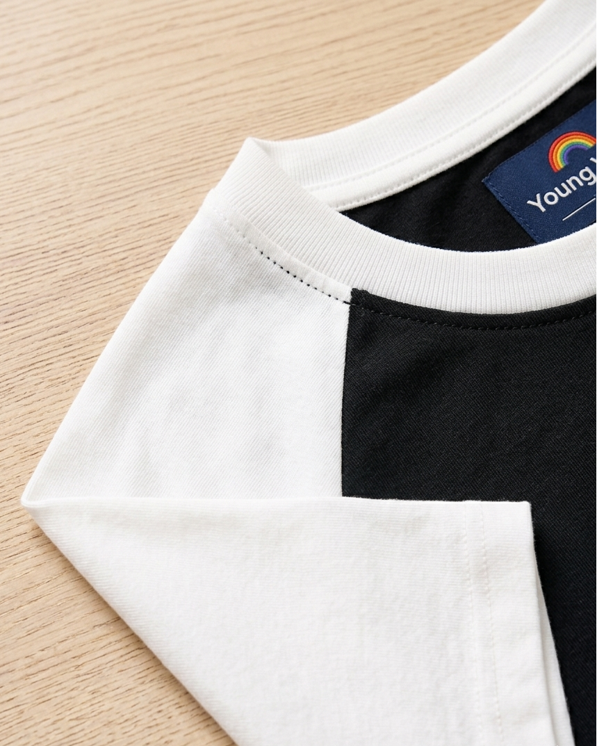 Kids Black with White Raglan Sleeve Cotton T-shirt focus on neck and sleeve part