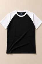 Kids Black with White Raglan Sleeve Cotton T-shirt Placed on lite beige background