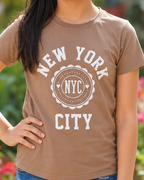Girl wearing a Brown T-shirt with NYC print close view