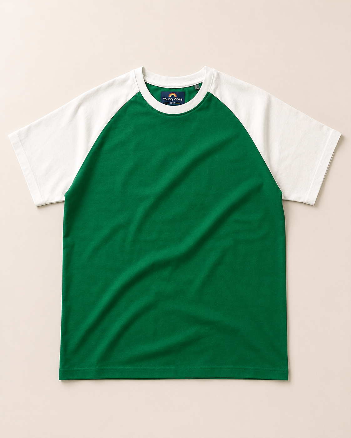 Kids Green with White Raglan Sleeve Cotton T-shirt Placed on lite grey background