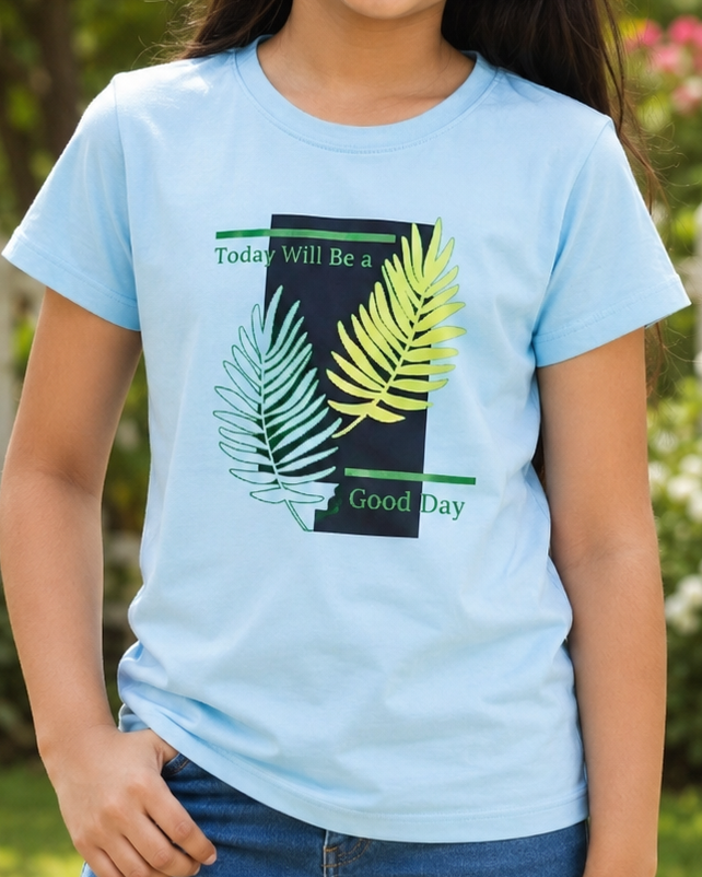 Girl wearing a Light Blue T-shirt with leave pattern close view 