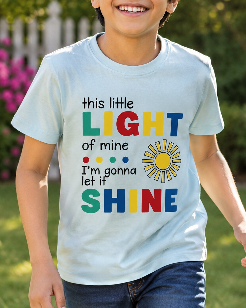 Boy wearing a Light blue T-shirt with colourful Little Light print close view