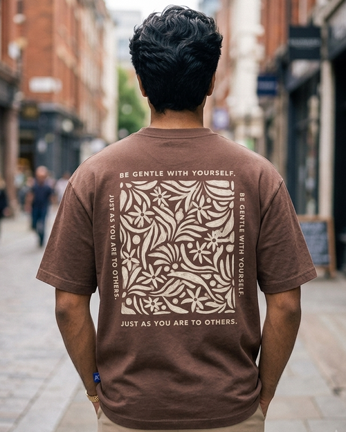 Man wearing Be Gentle print in Brown Oversized T-shirt