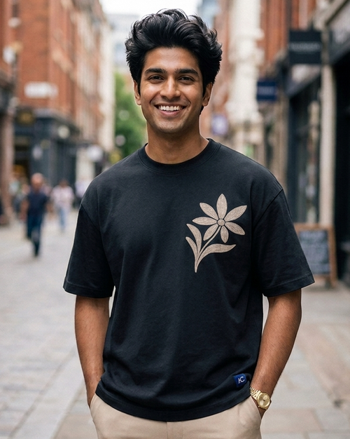 Man wearing a Floral Print in Black oversized T-shirt	