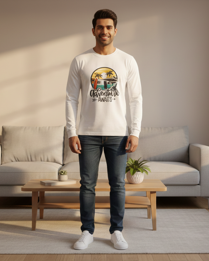 Man standing in a modern living room wearing a white sweatshirt with a colorful graphic design.