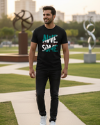 Man wearing a black t-shirt with 'Awesome' printed on it, standing outdoors.