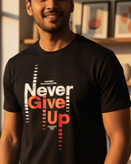 Man wearing a black t-shirt with 'Never Give Up' text in a home setting