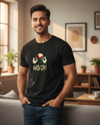 Man wearing a black t-shirt with a graphic design in a living room.