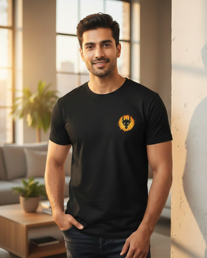 Man wearing a black t-shirt with a logo in a modern living room