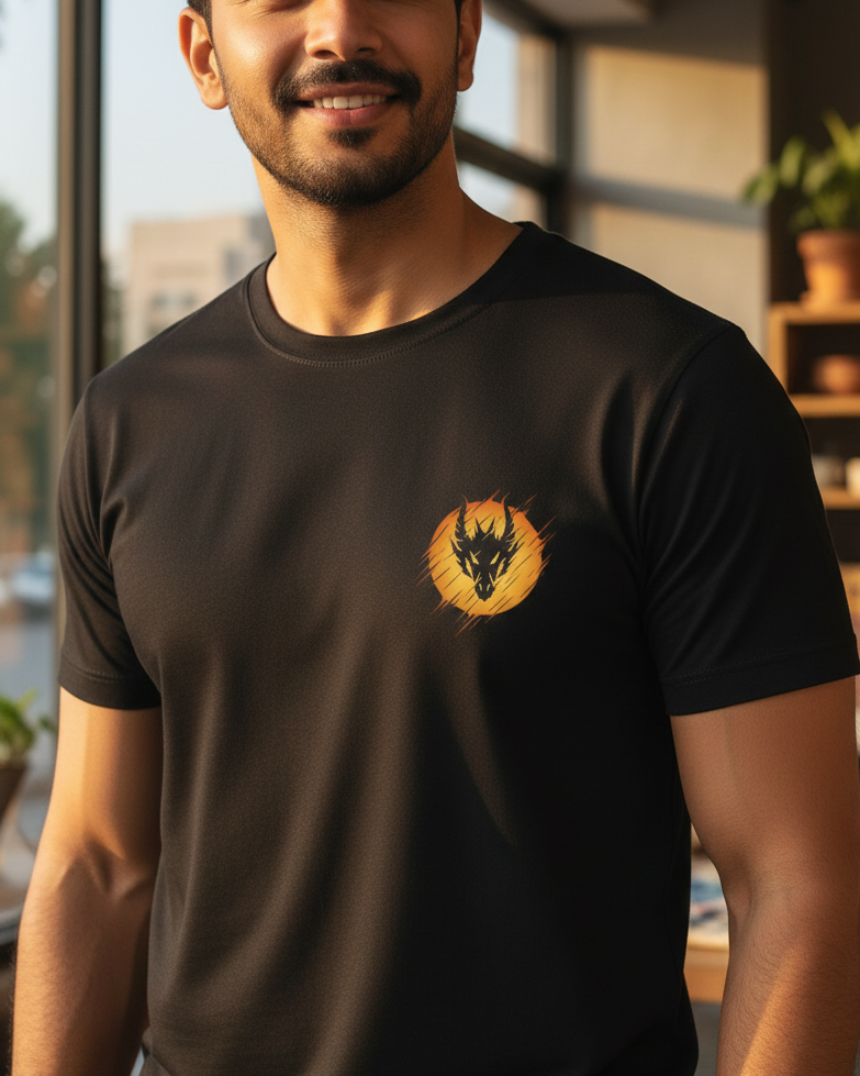 Man wearing a black t-shirt with a logo in an indoor setting