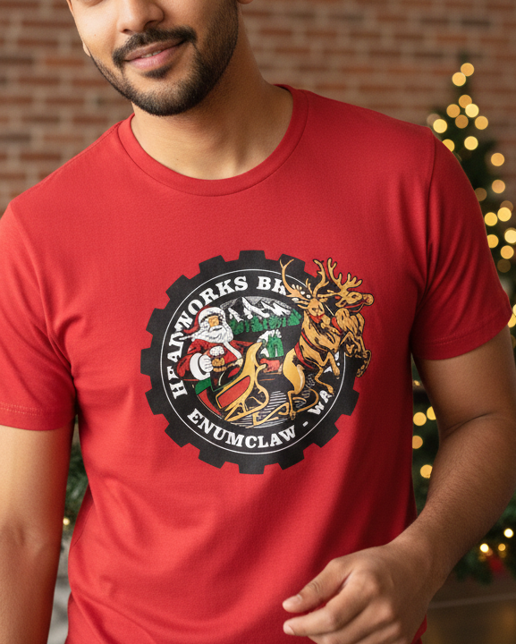 Man wearing a red t-shirt with a graphic design in a festive indoor setting.