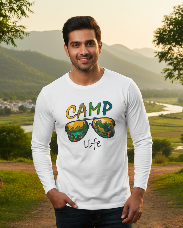 Man wearing a white long-sleeve shirt with 'Camp Life' design in a scenic outdoor setting