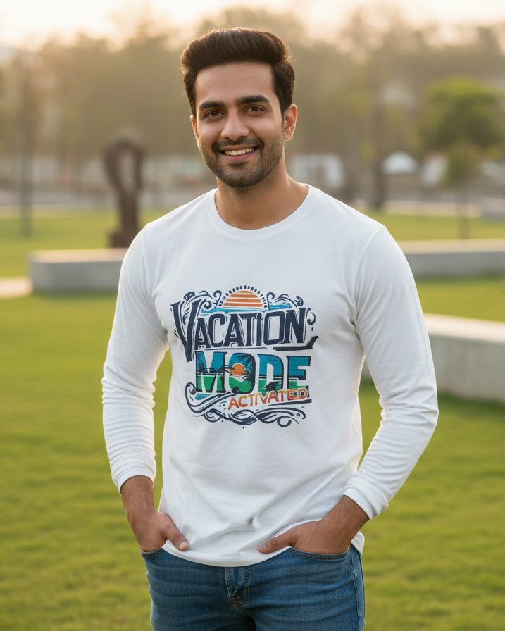 Man wearing a white long-sleeve shirt with 'Vacation Mode' text in an outdoor setting